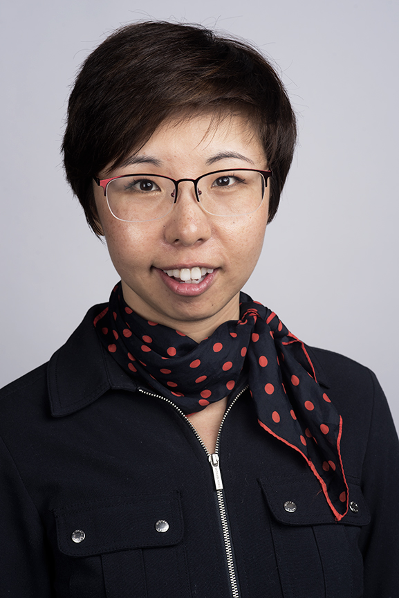 Dr. Meng Men Xu in black scarf with red polka dots, Theia winner for education