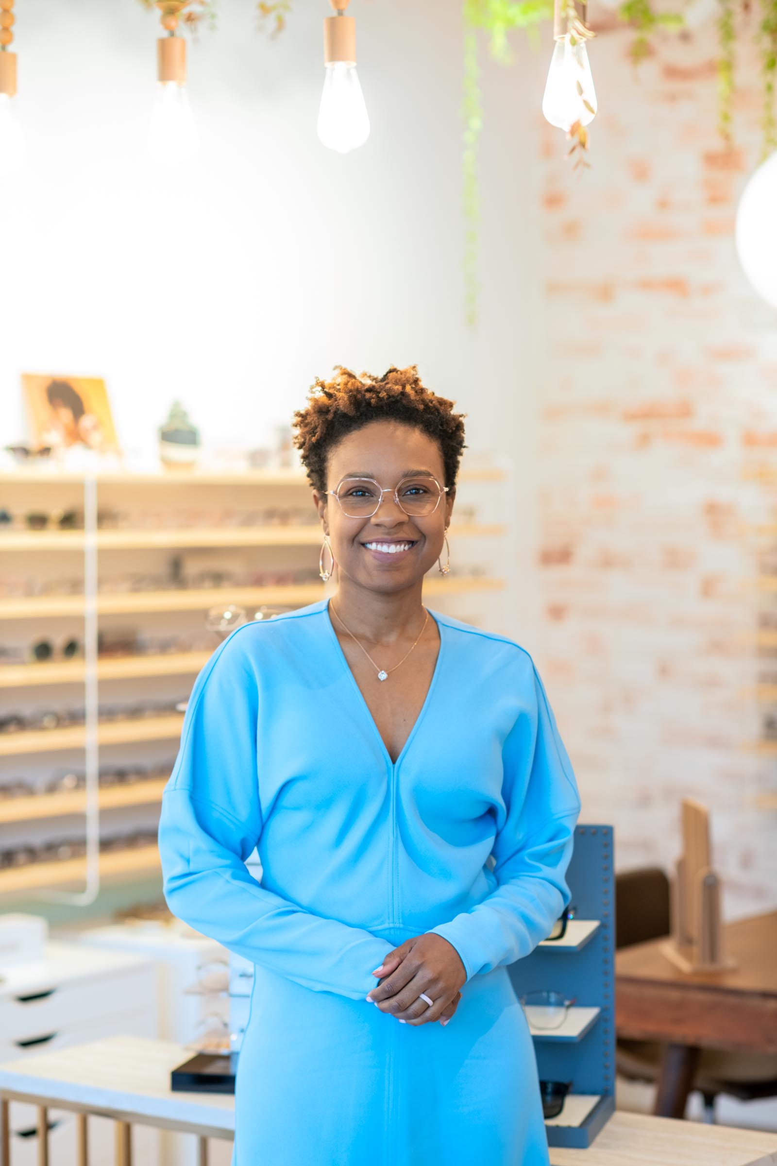 A photo of Dr. Kimble in her practice in a blue dress