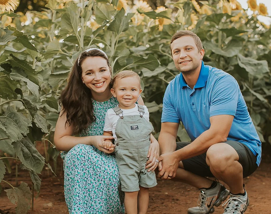A photo of Dr. Laura Sechler with her husband and son