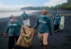 Alcon Expands Plastic Bank Partnership in 2023 to Further Support Sustainability Efforts A photo of people cleaning up a beach