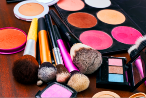 Variety of makeup powders, shadows, blushes and brushes. The cosmetics industry is not heavily regulated. 