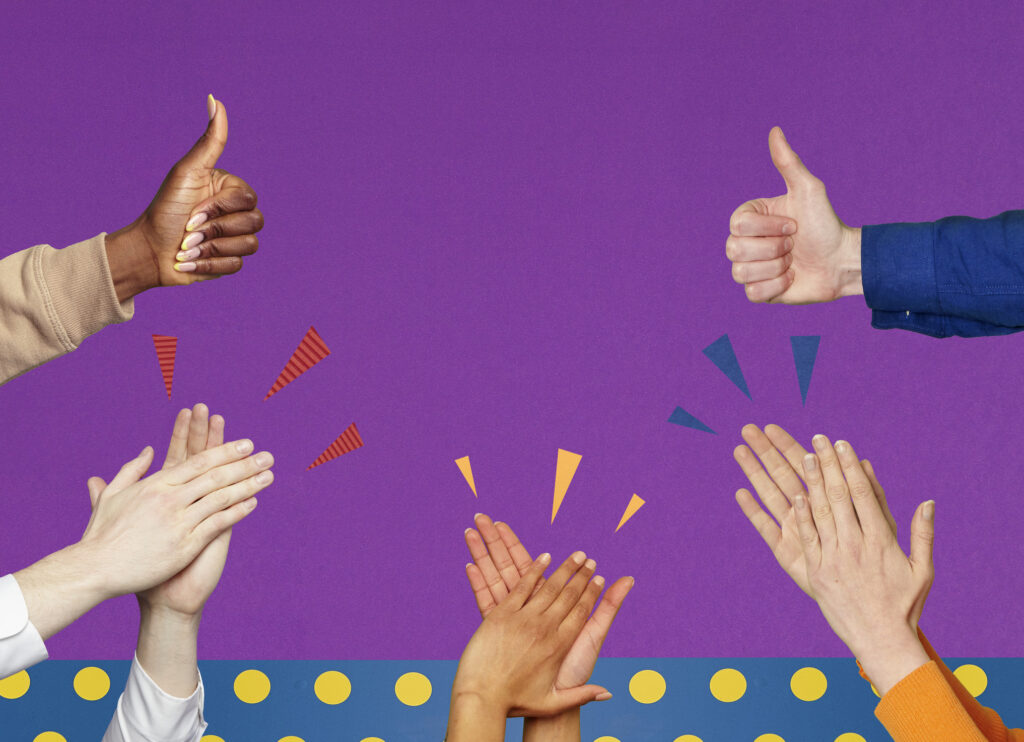 group of hands with thumbs up and hands clapping against purple background