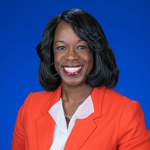 Dr. Sherrol Reynolds in orange jacket