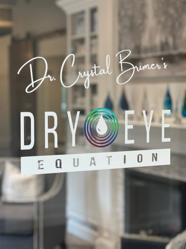 the glass doors leading into the practice. In script it says Dr. Crystal's Brimer - then in logo - Dry Eye Equation