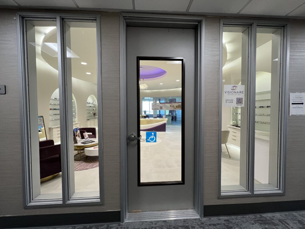 the view from outside the practice, looking in through the glass walls
