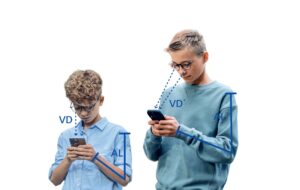 image shows two young teens looking at their screens with dotted lines to show how their angle of gaze is very different