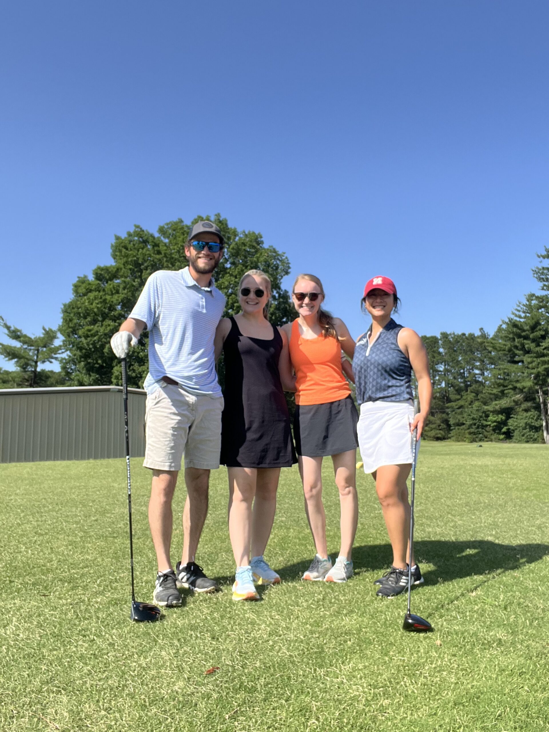 Kendra golfs with friends.