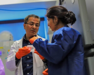 two researchers in a lab where they are doing research on drusen