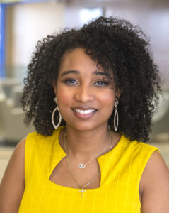 Dr. Alexia clark in a bright yellow top 