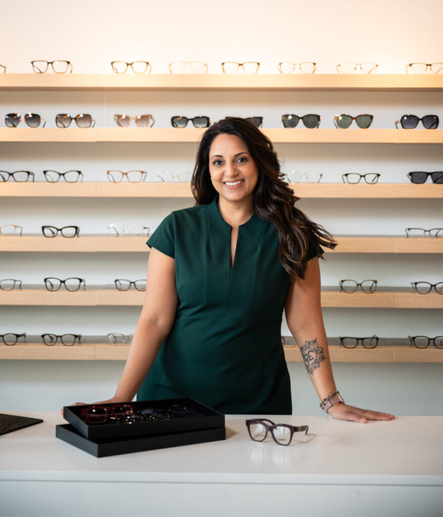 Dr. Patel at the front counter of her new practice, Radiance Eye Care