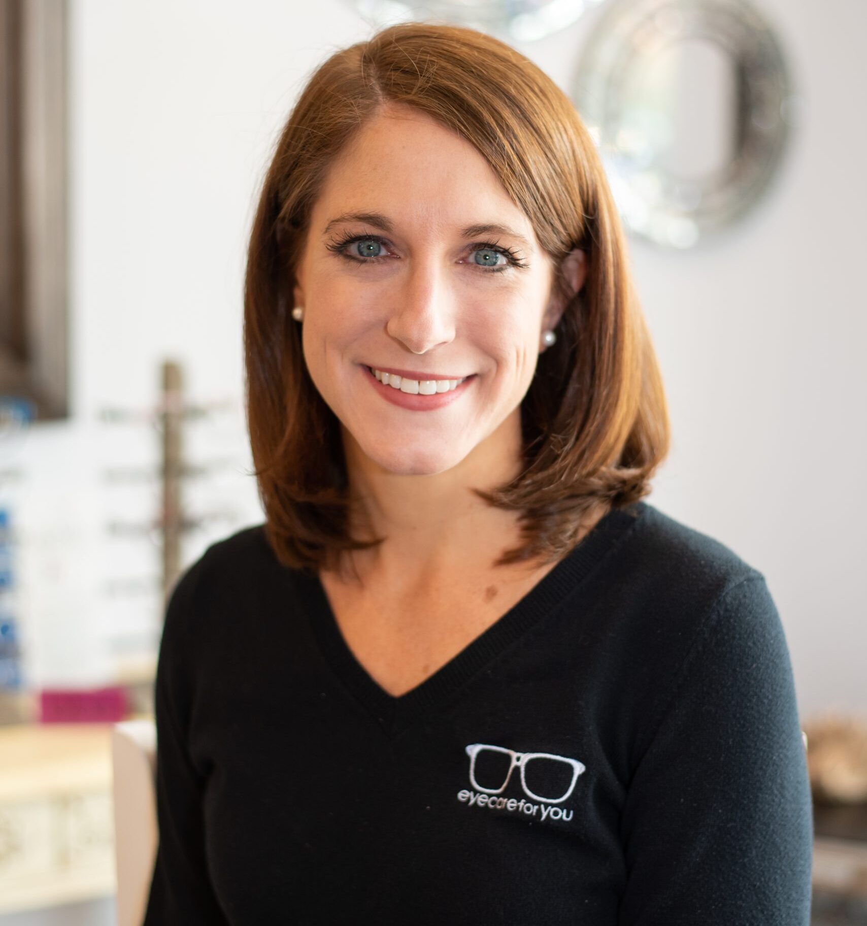 dr. Kara foster in shirt with practice logo