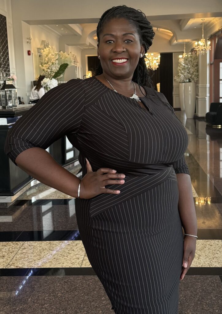 Dr. Justin in a black dress
