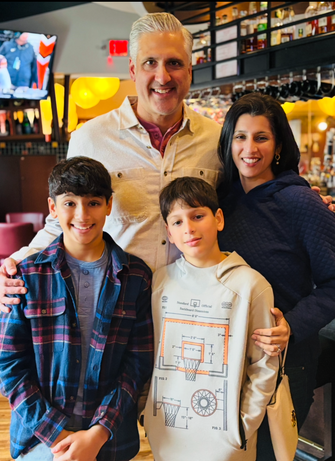 Dr. Neha Dada with her husband and sons