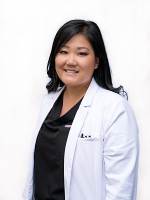 Dr. Brianna Kebo in white coat talks about efficiency in the exam lane