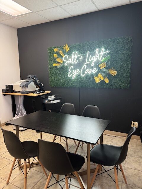 Dr. Torres created the faux living wall, adorned with a custom neon sign from Etsy