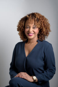 Camille Cohen in blue suit