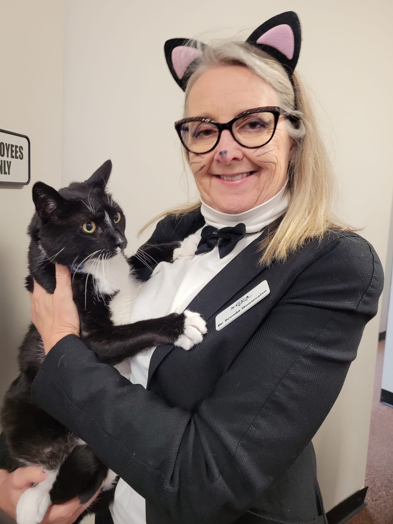 Dr. Montecalvo dresses up as a tuxedo cat.