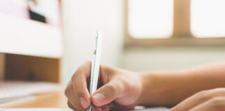 When is the Right Time to Refinance? Businessman hand signing the document business contract agreement