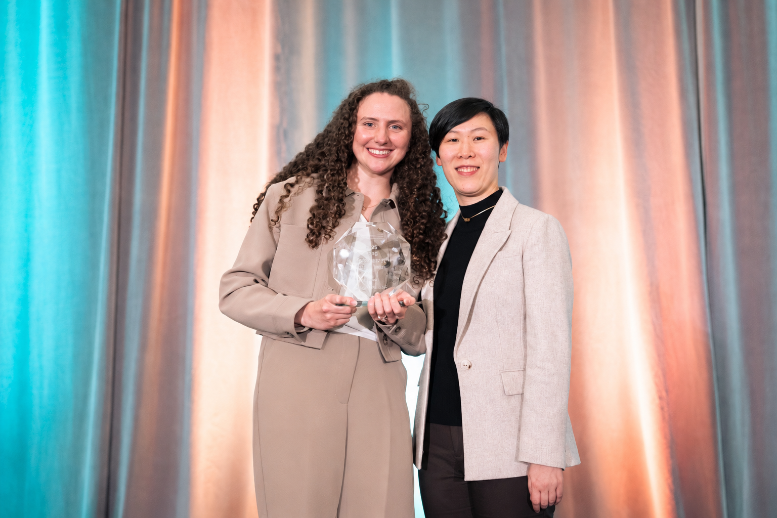Dr. Capo (left) receives the 2026 British Columbia Young Optometrist of the Year award from xxx (right).